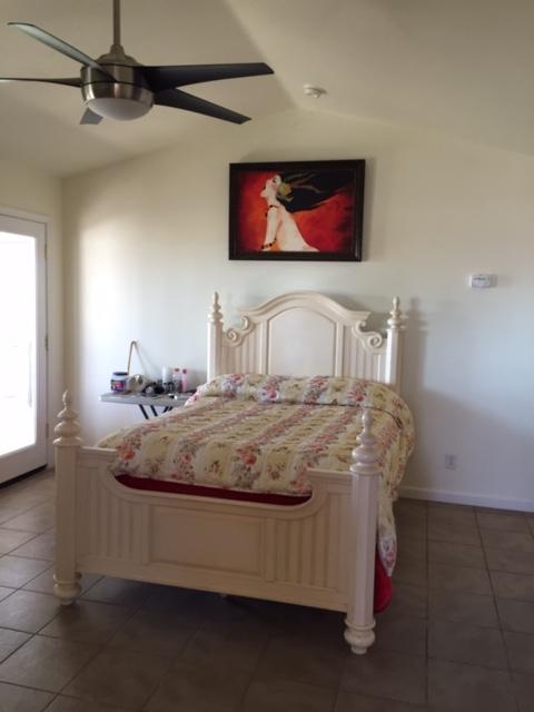 21215 Gyle Road Corning, CA 96021 - Photo 15 of 75 a room with a bed and a flat screen tv