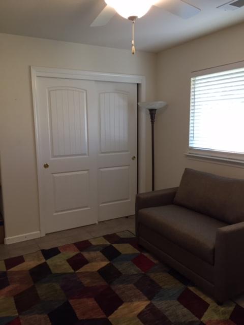 21215 Gyle Road Corning, CA 96021 - Photo 25 of 75 a living room with furniture and a rug