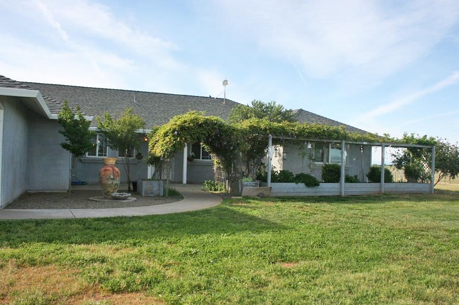 21215 Gyle Road Corning, CA 96021 - Photo 5 of 75 a view of a house with a yard and sitting area