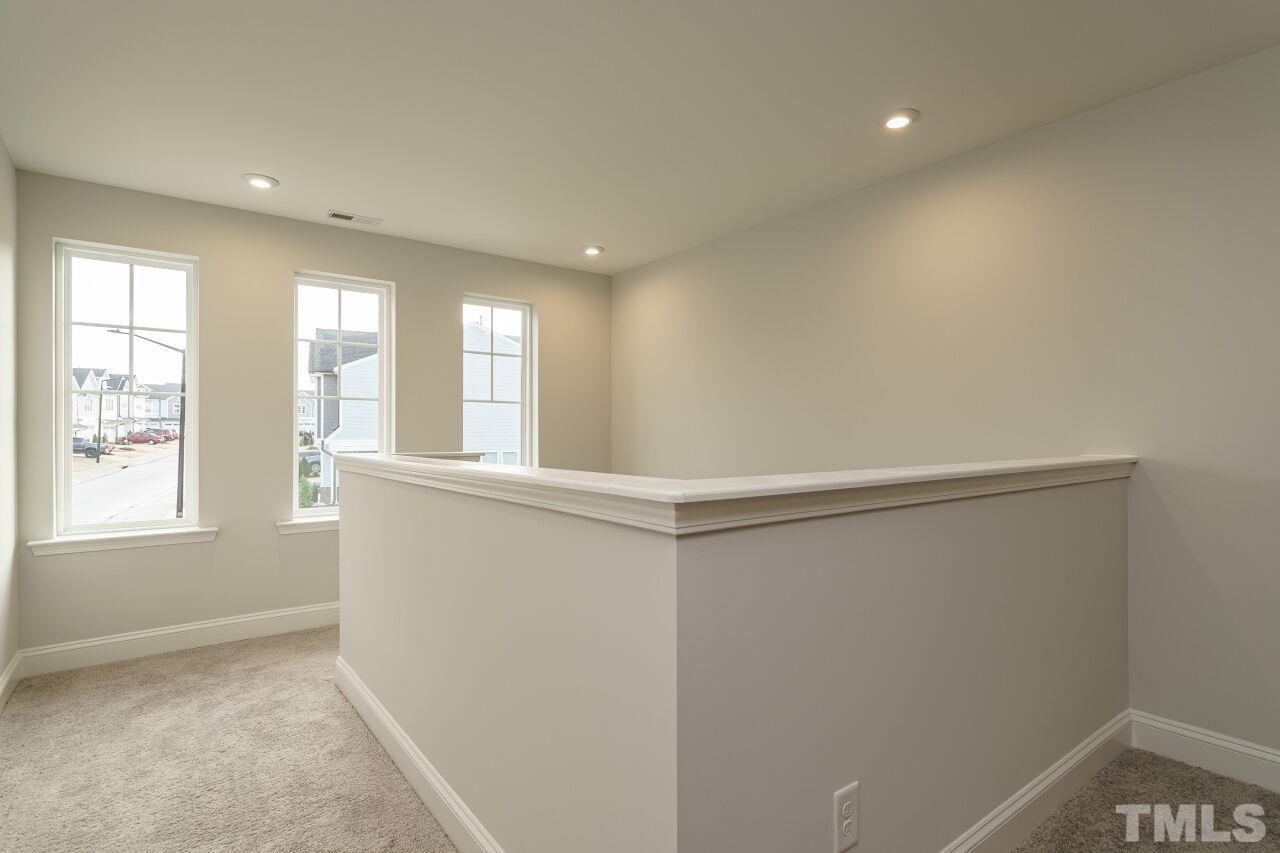 3113 Dunnock Drive, Unit 3 Durham, NC 27713 - Photo 17 of 30 a view of an empty room with a window