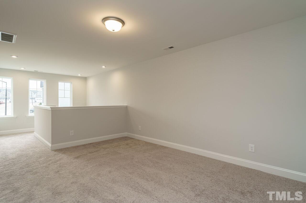 3113 Dunnock Drive, Unit 3 Durham, NC 27713 - Photo 19 of 30 an empty room with a empty space and windows