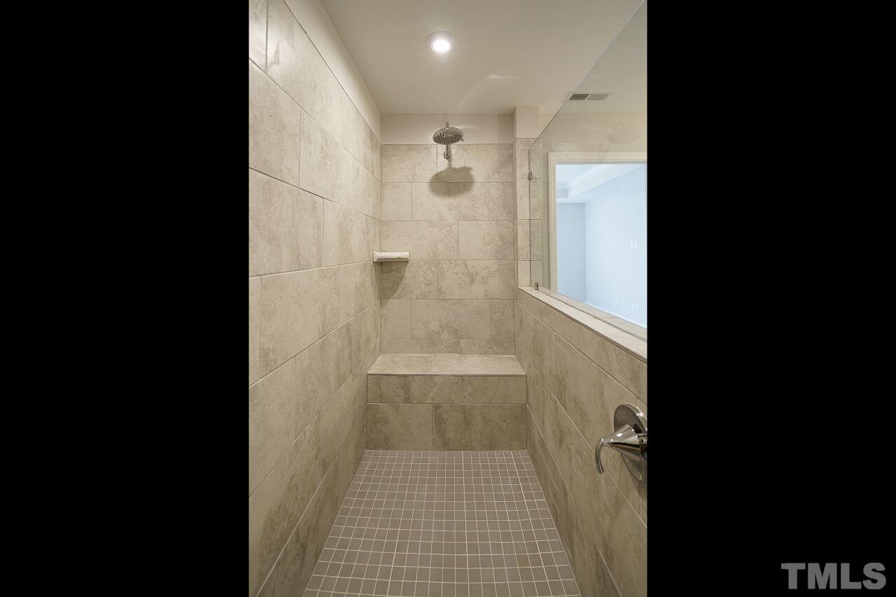 3113 Dunnock Drive, Unit 3 Durham, NC 27713 - Photo 24 of 30 a bathroom with a shower and a toilet