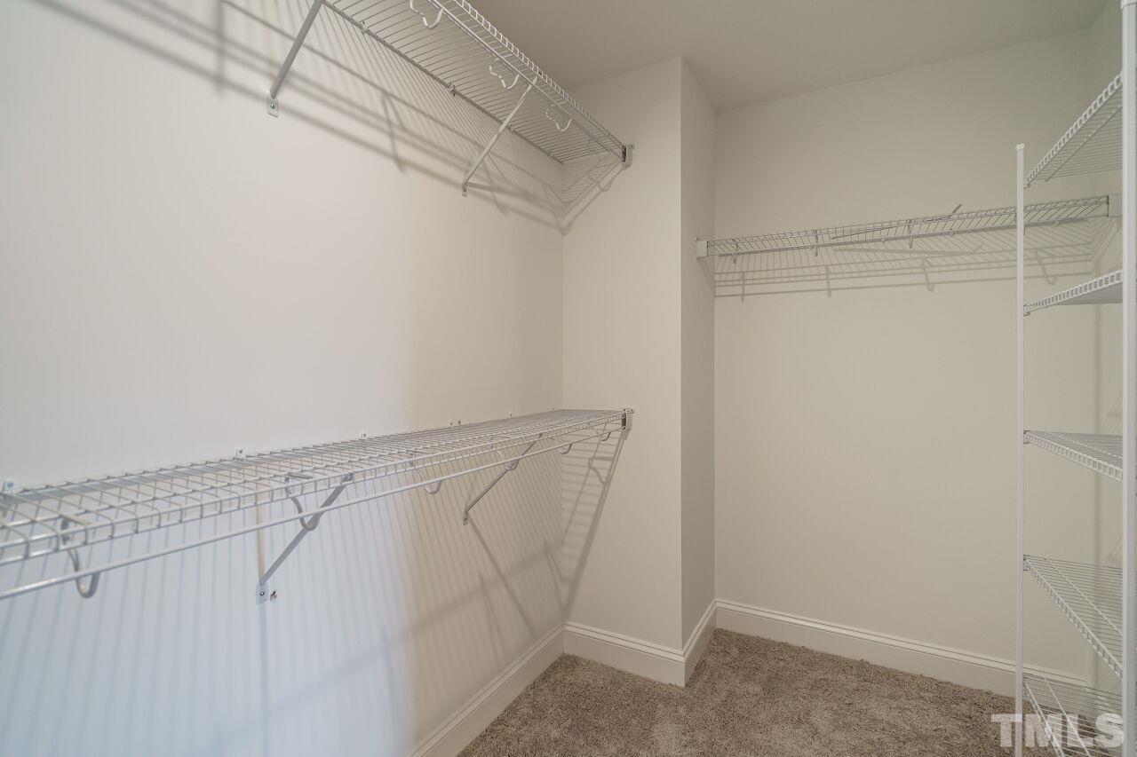 3113 Dunnock Drive, Unit 3 Durham, NC 27713 - Photo 25 of 30 a view of a room with racks on the wall