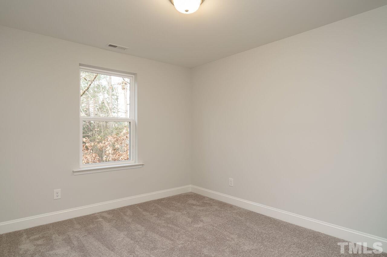 3113 Dunnock Drive, Unit 3 Durham, NC 27713 - Photo 28 of 30 an empty room with a window