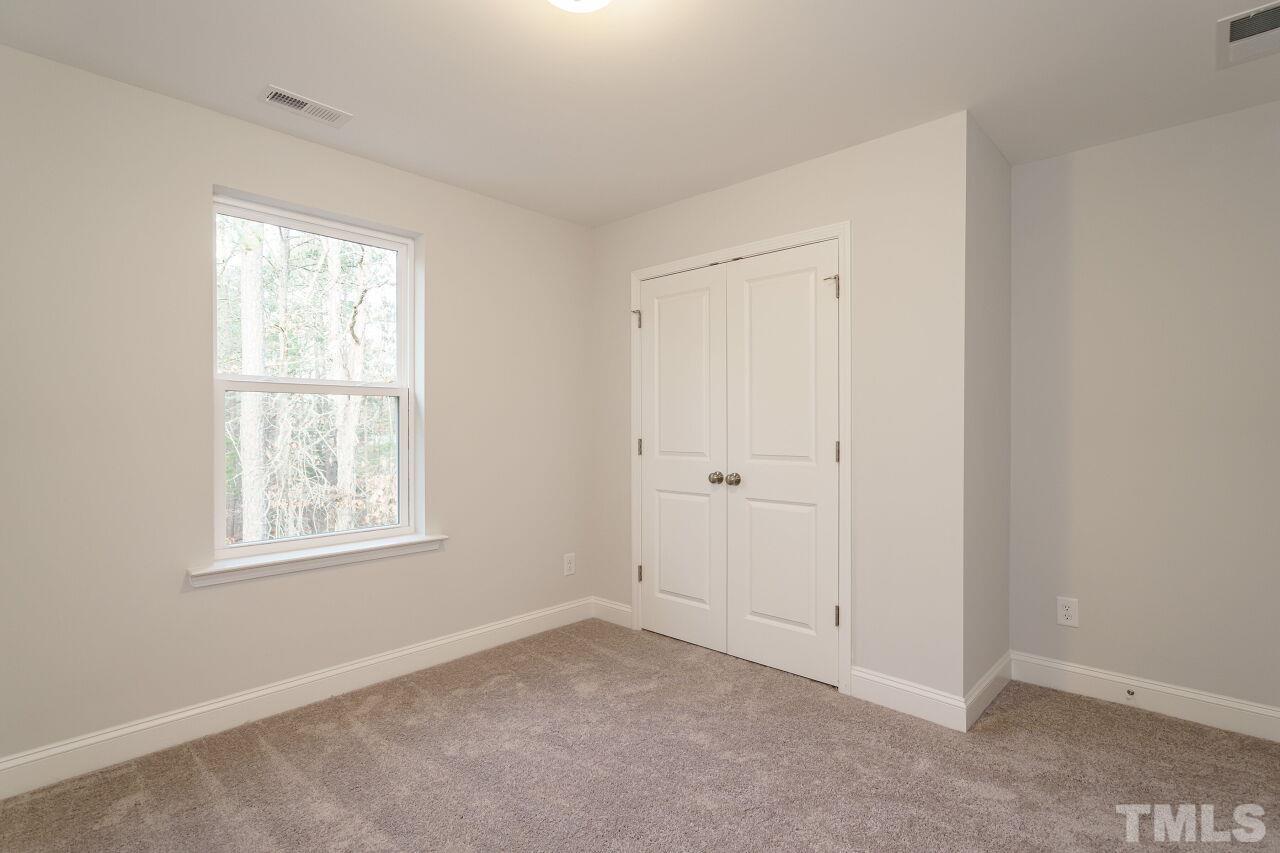 3113 Dunnock Drive, Unit 3 Durham, NC 27713 - Photo 29 of 30 an empty room with windows