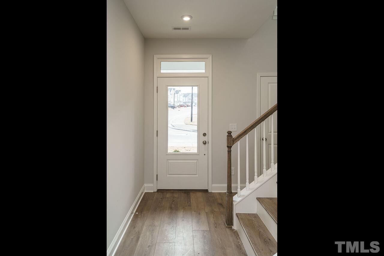 3113 Dunnock Drive, Unit 3 Durham, NC 27713 - Photo 4 of 30 a view of an entryway with wooden floor