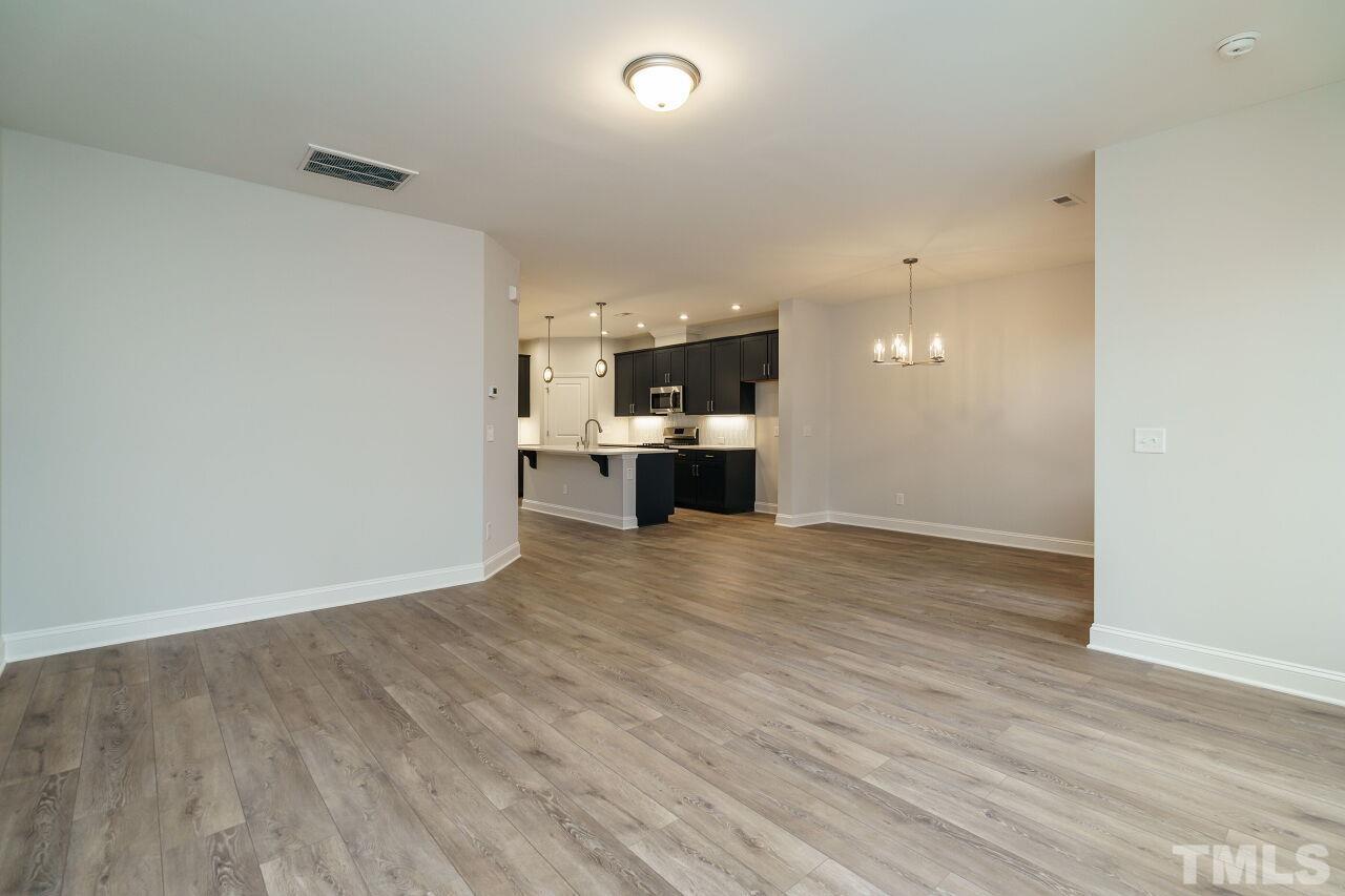 3113 Dunnock Drive, Unit 3 Durham, NC 27713 - Photo 7 of 30 a view of empty room with wooden floor
