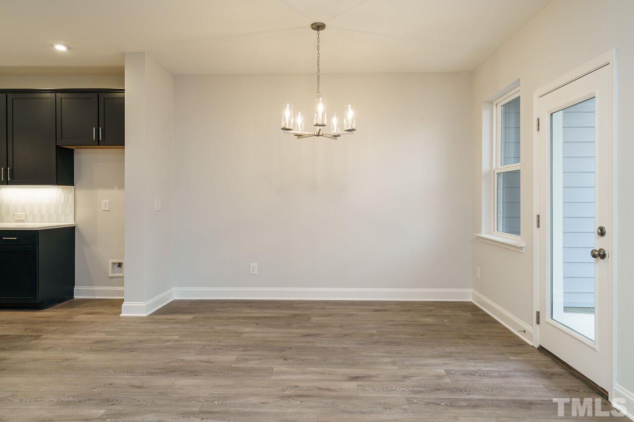 3113 Dunnock Drive, Unit 3 Durham, NC 27713 - Photo 10 of 30 a view of a livingroom with wooden floor
