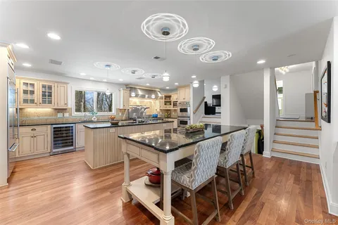 a kitchen with stainless steel appliances granite countertop a stove and a refrigerator