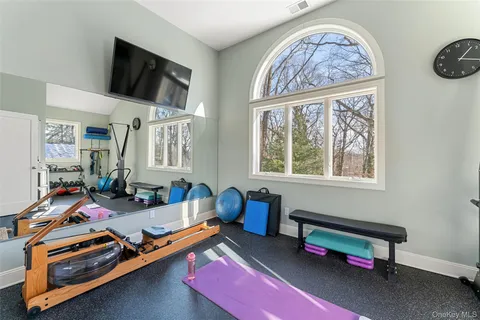 a bedroom with furniture and a window