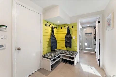 a bathroom with a window and a shower