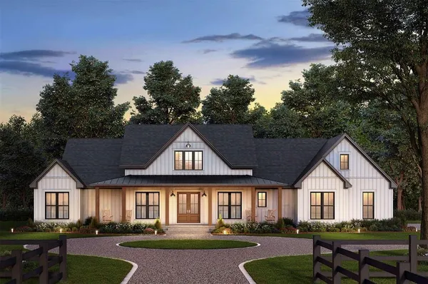 a front view of a house with a yard table and chairs