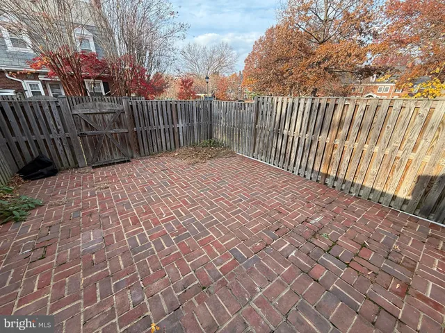 a picture of a bathroom and a street sign