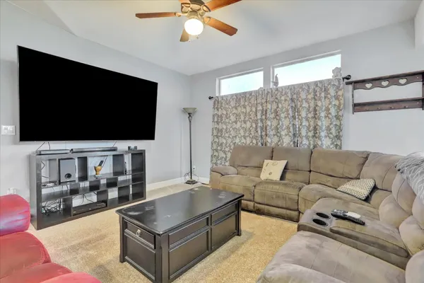 a kitchen with a stove and a refrigerator