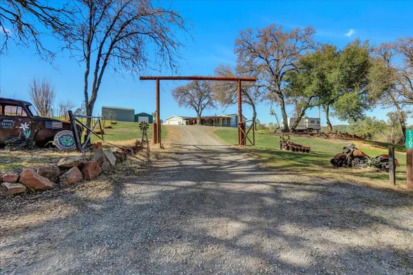 a view of backyard with swimming pool and outdoor seating