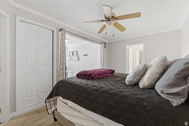 282 West 960 South, Unit C Provo, UT 84601 - Photo 12 of 33 Bedroom featuring crown molding, light carpet, a closet, and a ceiling fan