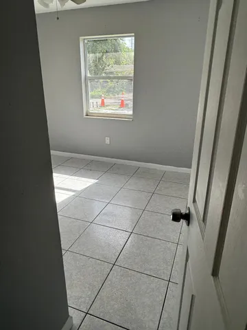 a view of an empty room and window