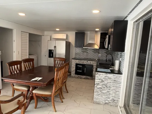 a dining room with furniture and a fireplace