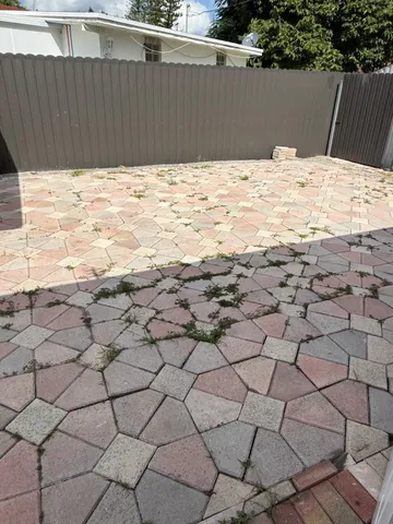 a view of wooden fence and trees