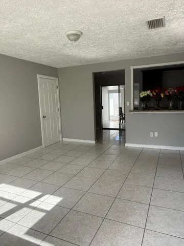 a view of an empty room and window