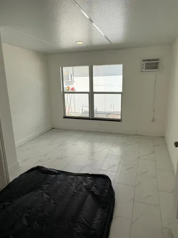 a view of an empty room and window