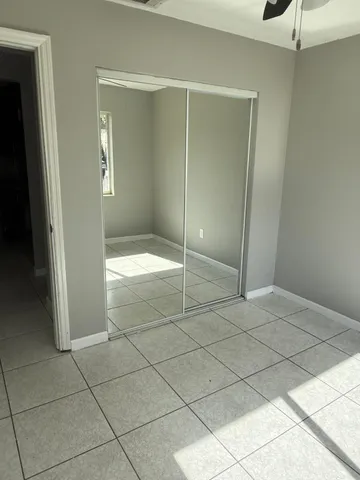 a bathroom with a shower and closet in it