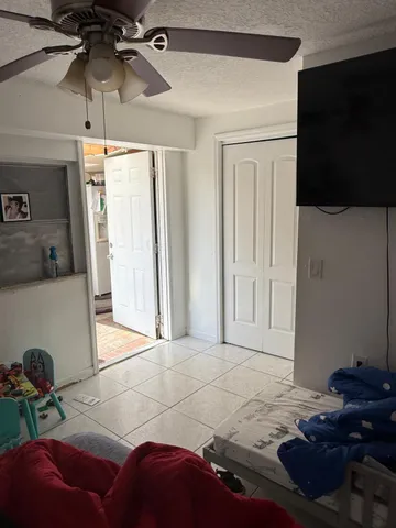 a bedroom with a bed and a mirror