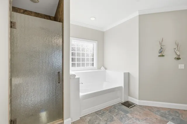 a white bath tub sitting next to a window