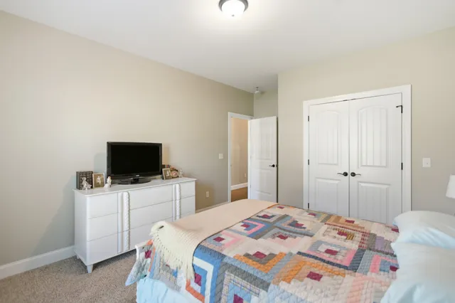 a bathroom with a double vanity sink mirror and toilet