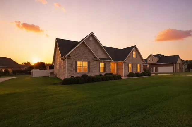 a front view of a house with a yard