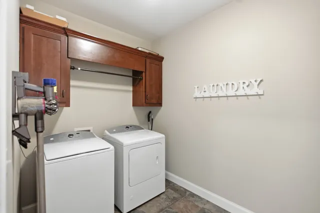 a view of storage and utility room with washer and dryer