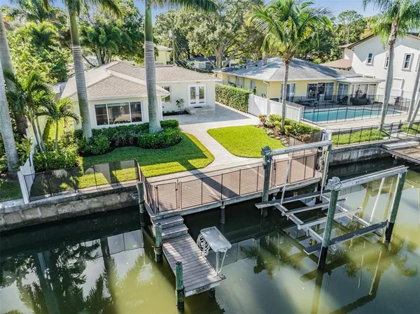 a view of a swimming pool with a patio