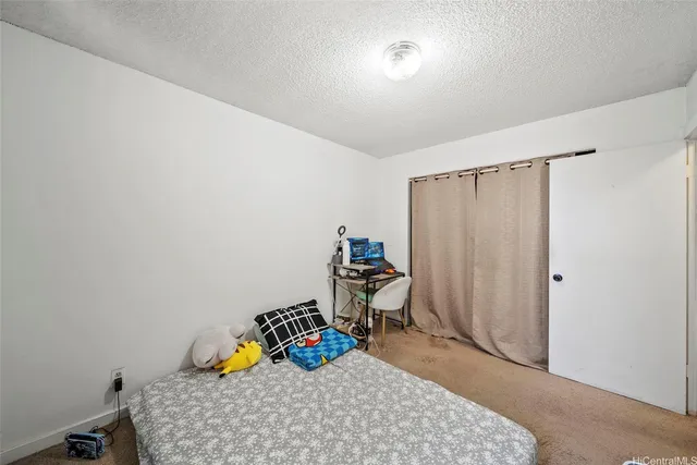 a room with a wooden floor and a window