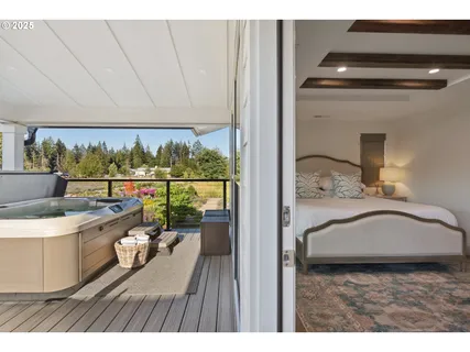 a balcony view with a sink and wooden floor
