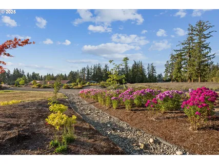 a view of a lake with beach and city view