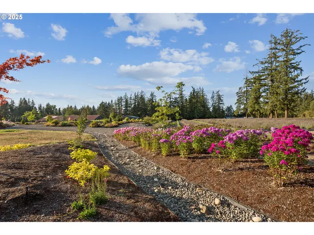 a view of a lake with beach and city view