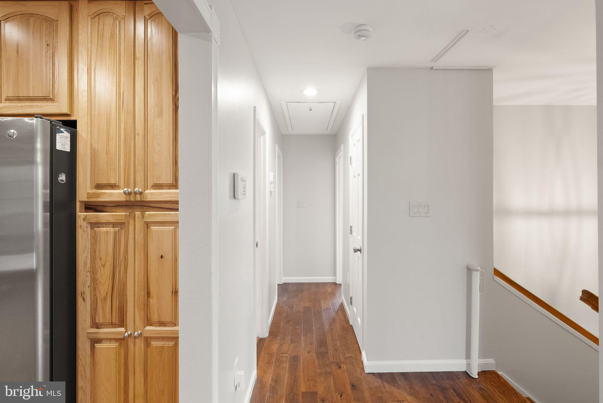 6738 Kelly Road Warrenton, VA 20187 - Photo 14 of 55 a view of a hallway with wooden floor