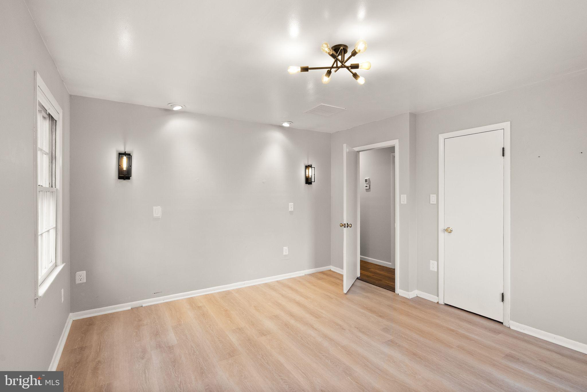 6738 Kelly Road Warrenton, VA 20187 - Photo 17 of 55 a view of an empty room with a chandelier fan