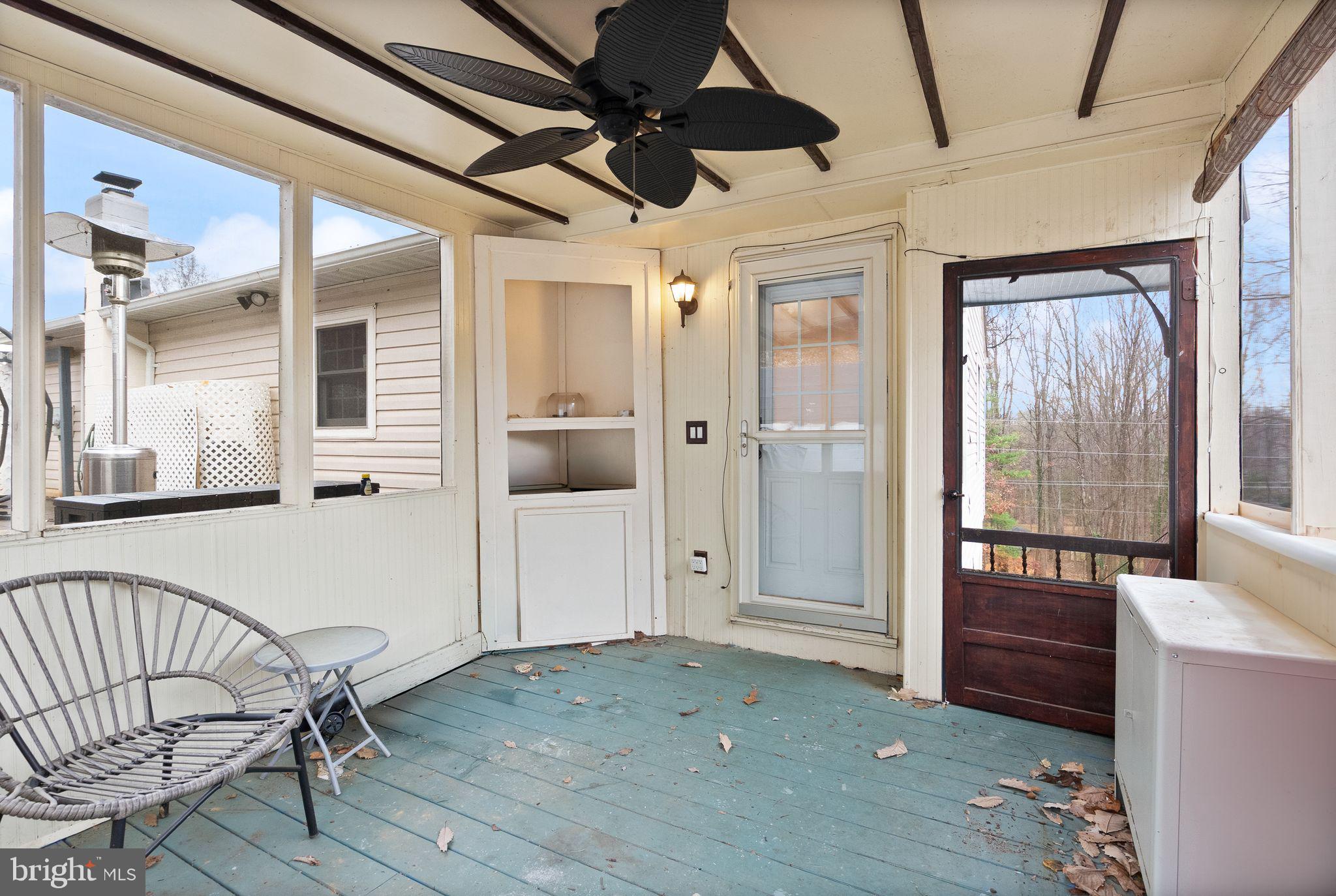 6738 Kelly Road Warrenton, VA 20187 - Photo 35 of 55 a view of a hallway with wooden floor and windows
