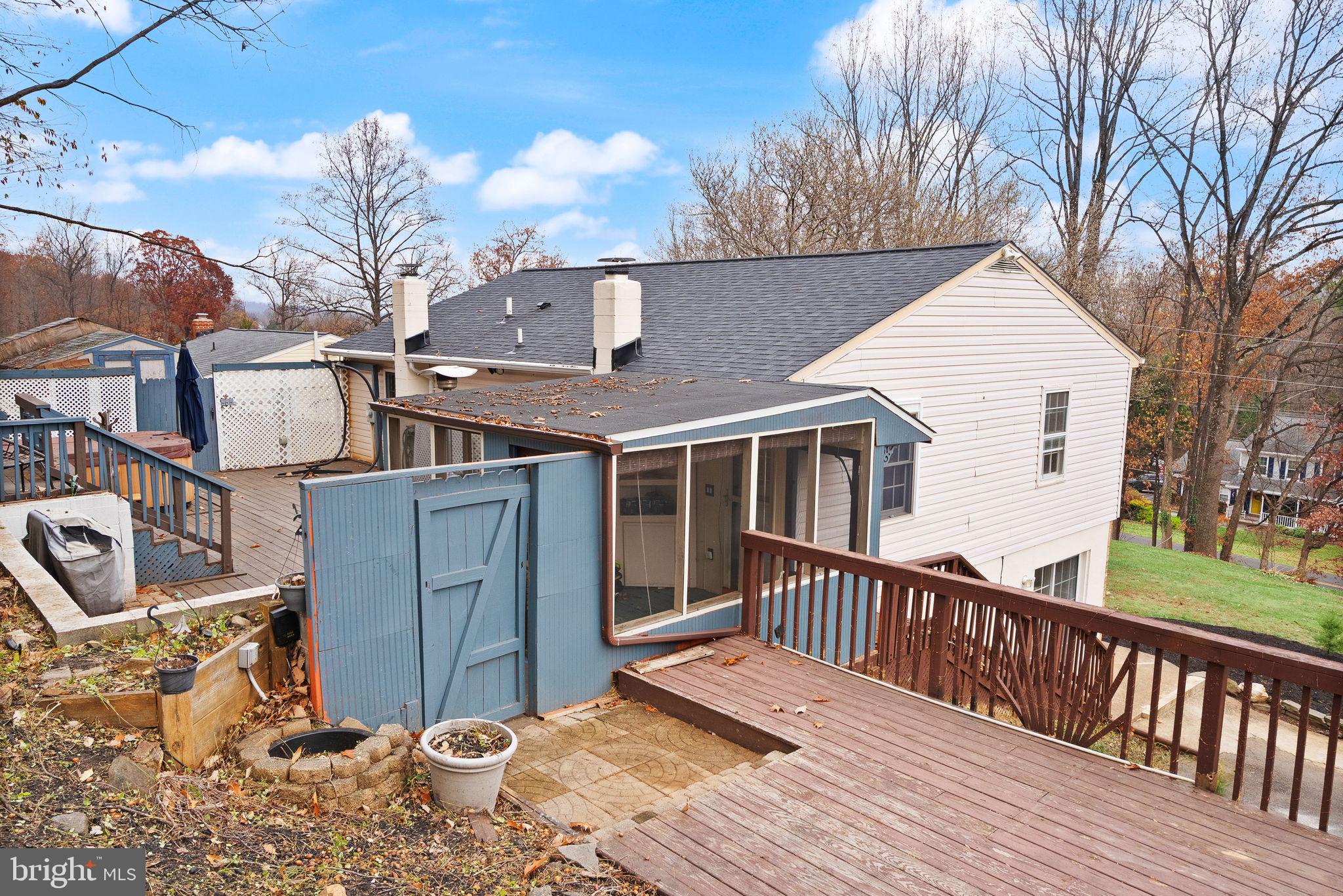6738 Kelly Road Warrenton, VA 20187 - Photo 43 of 55 a view of a house with a wooden deck