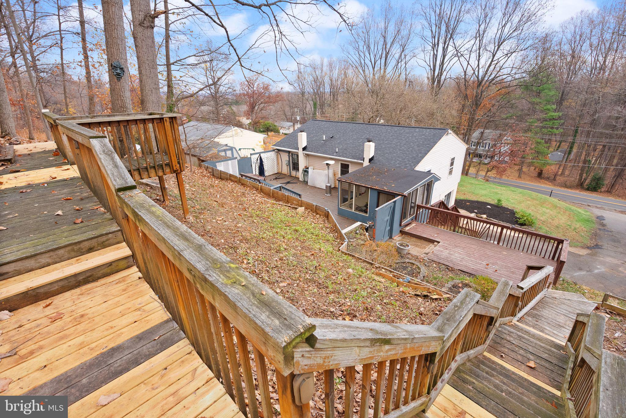 6738 Kelly Road Warrenton, VA 20187 - Photo 46 of 55 a view of balcony with wooden floor and outdoor seating