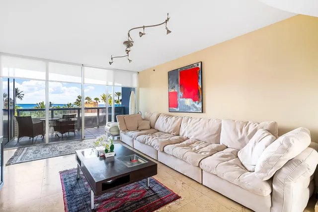 a dining room with furniture and a view of kitchen