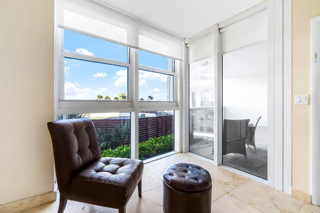 a bedroom with furniture and a rug