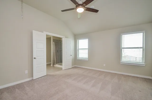 a view of an empty room with a window