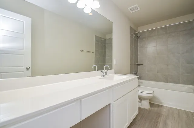 a view of small space with racks on the wall and a window