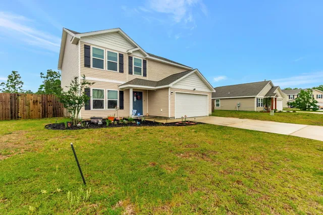 a front view of a house with yard