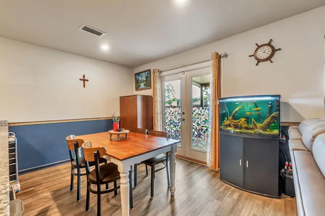 a view of a dining room with furniture window and wooden floor