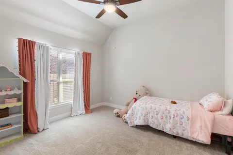 a bedroom with a bed and a cabinets