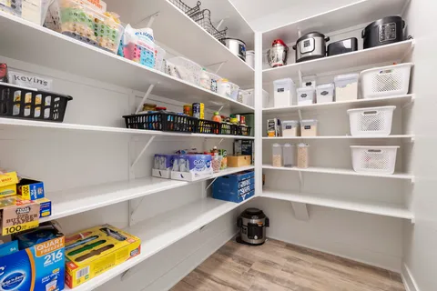 a room with a book shelf and a couch
