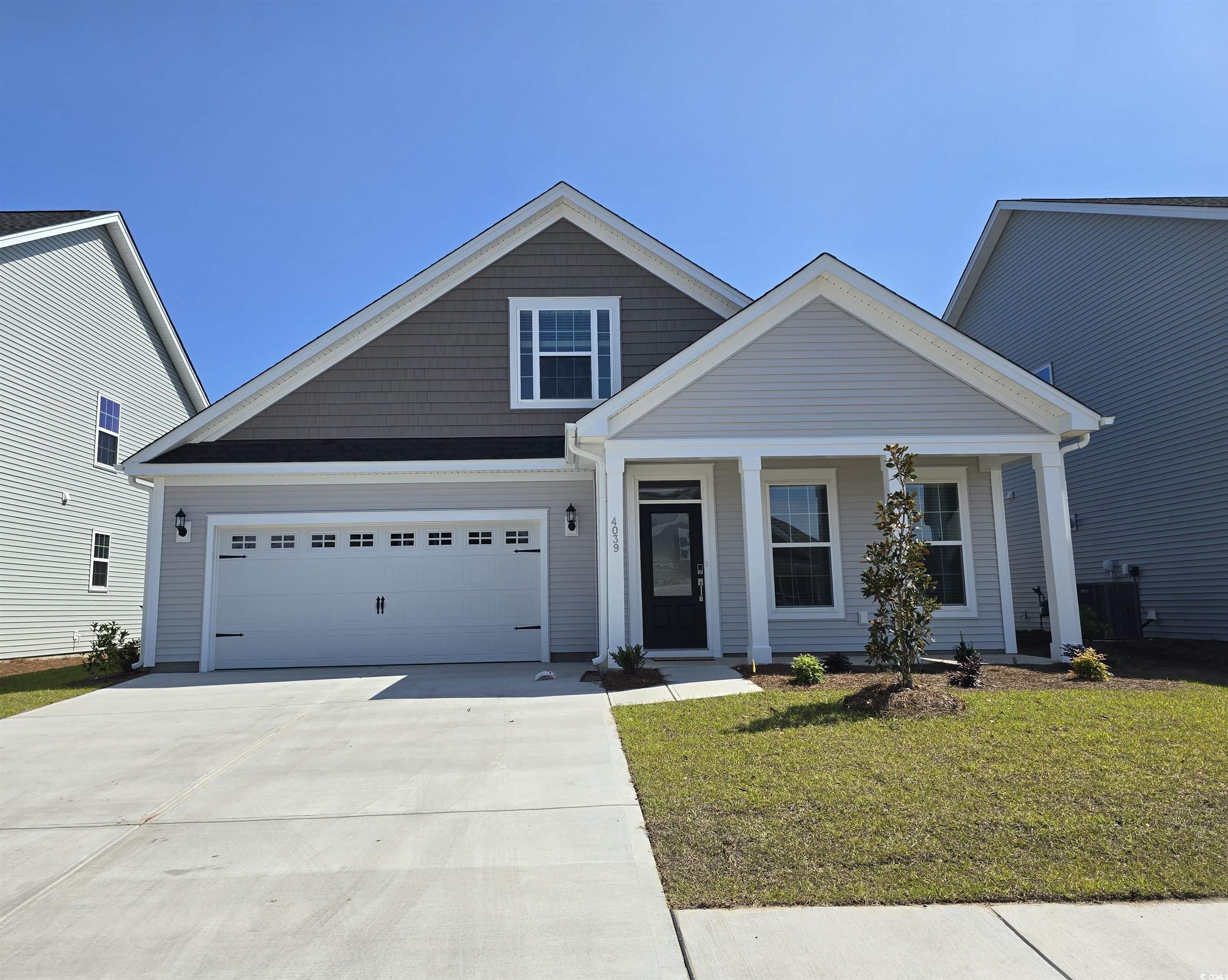 4039 Bucolic Loop Myrtle Beach, SC 29588 - Photo 1 of 1 View of front of home with driveway, a front lawn,